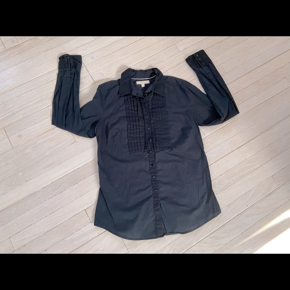 Woman’s black button down blouse